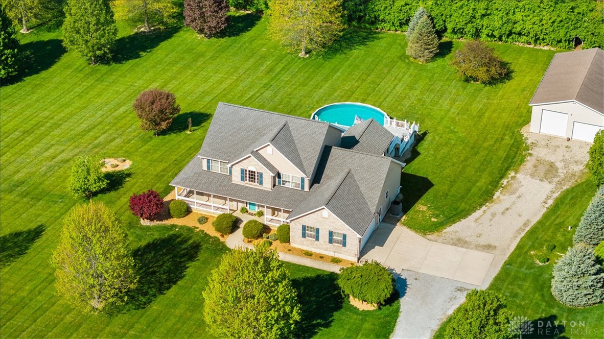 841 Willow Road Springfield, OH 45502 - Photo 1 of 64 This expansive estate features a classic home, lush landscaping, and a welcoming pool.