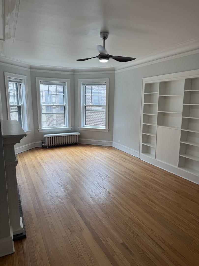624 Sheridan Road, Unit 2 Evanston, IL 60202 - Photo 2 of 7 a view of an empty room with a window and wooden floor