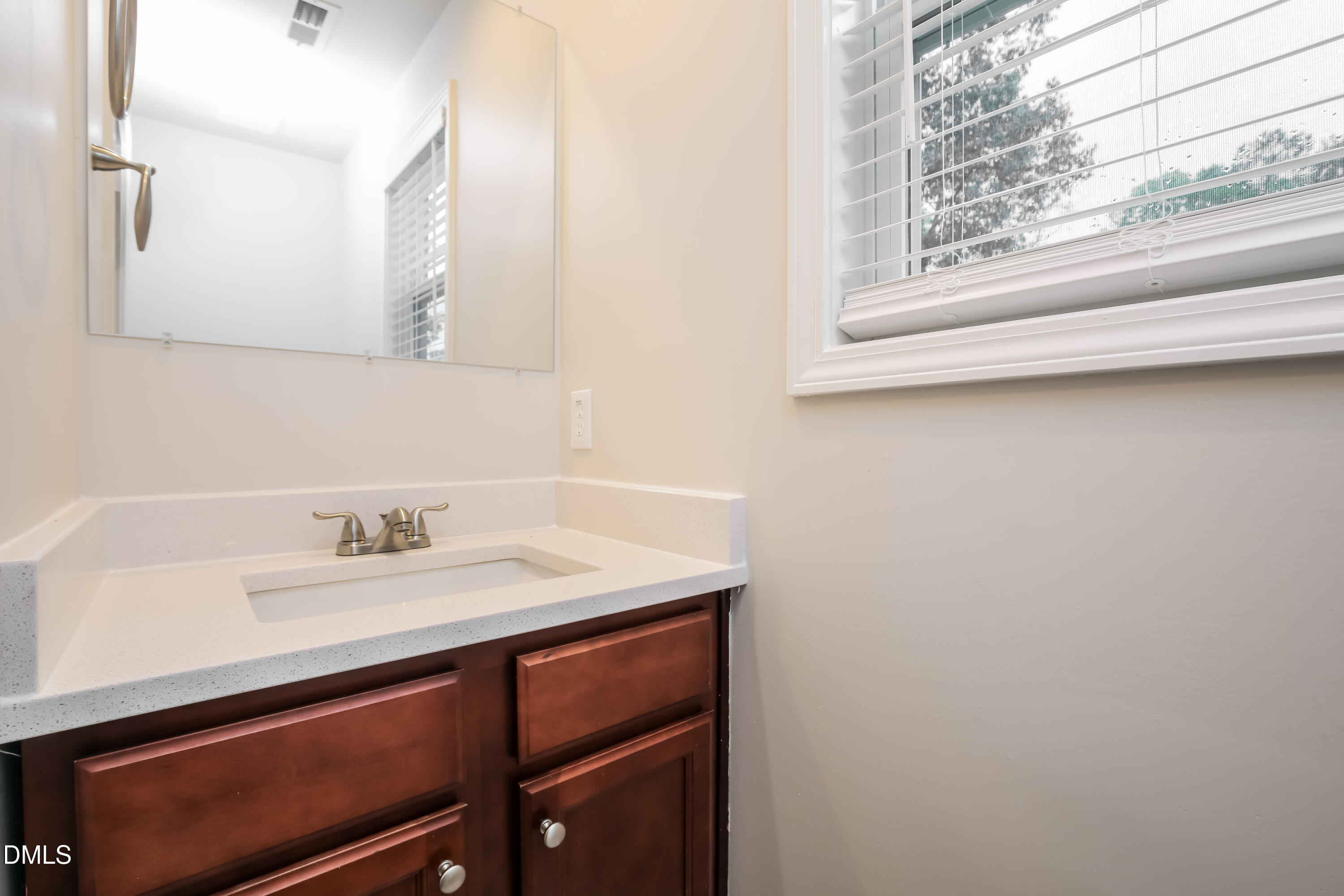 195 Cherryhill Drive Four Oaks, NC 27524 - Photo 14 of 17 a bathroom with a sink and a mirror