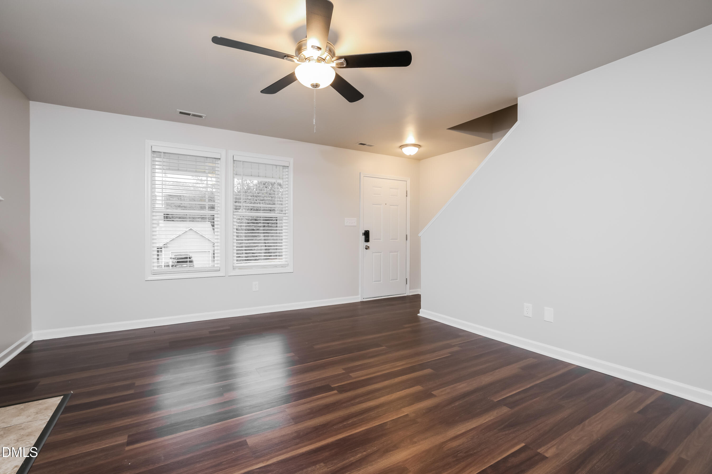 195 Cherryhill Drive Four Oaks, NC 27524 - Photo 3 of 17 a view of an empty room with wooden floor and a window