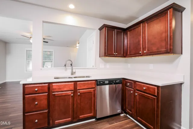 a kitchen with sink and cabinets