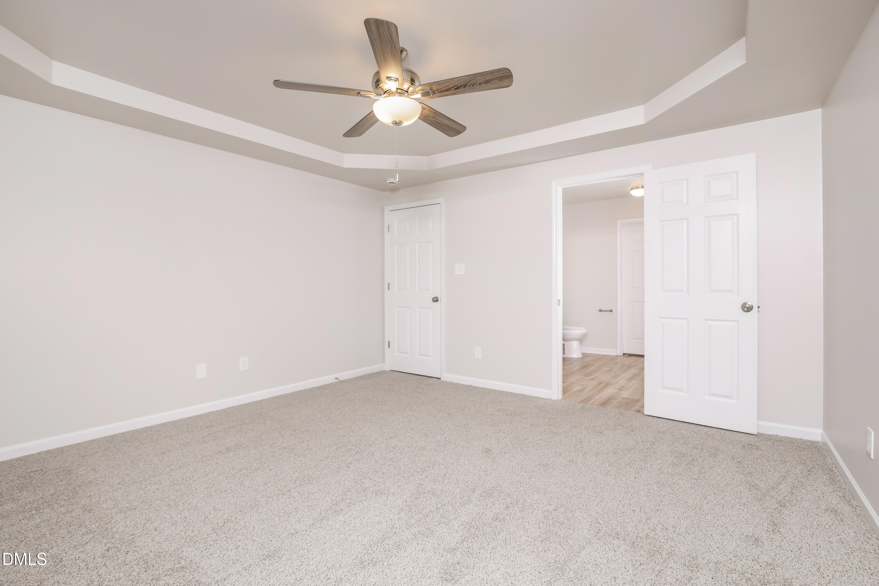 195 Cherryhill Drive Four Oaks, NC 27524 - Photo 7 of 17 an empty room with a ceiling fan and a ceiling fan