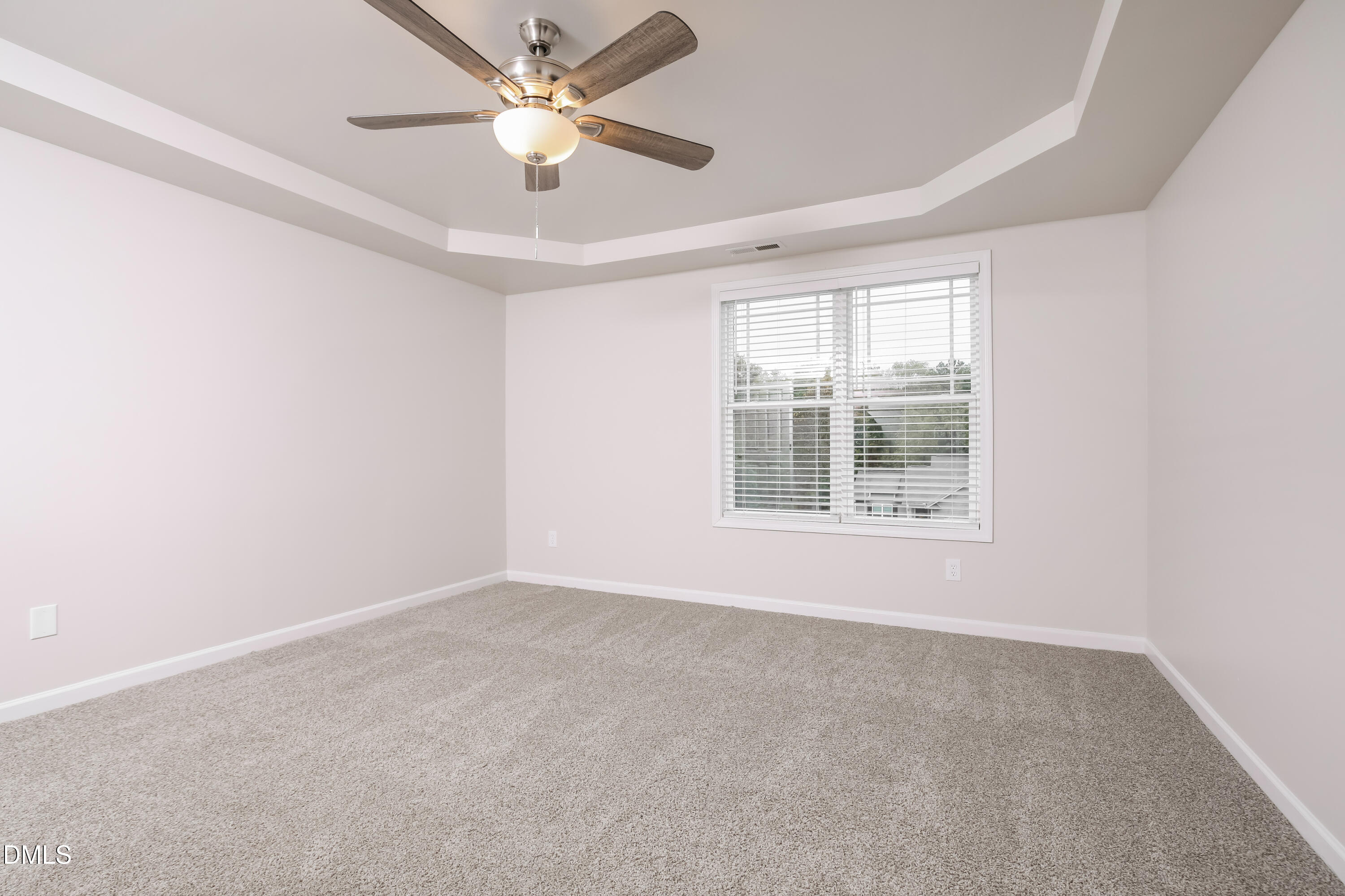 195 Cherryhill Drive Four Oaks, NC 27524 - Photo 8 of 17 an empty room with a window and a fan