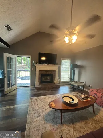 a view of a kitchen with kitchen island a counter top space a sink and appliances