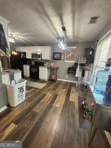 a bathroom with a sink mirror and vanity