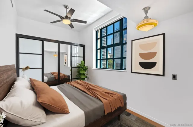 a bedroom with natural light and a window
