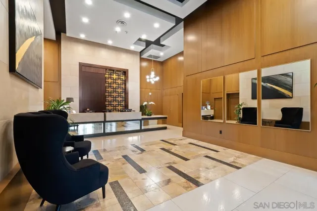 a living room with furniture and potted plants