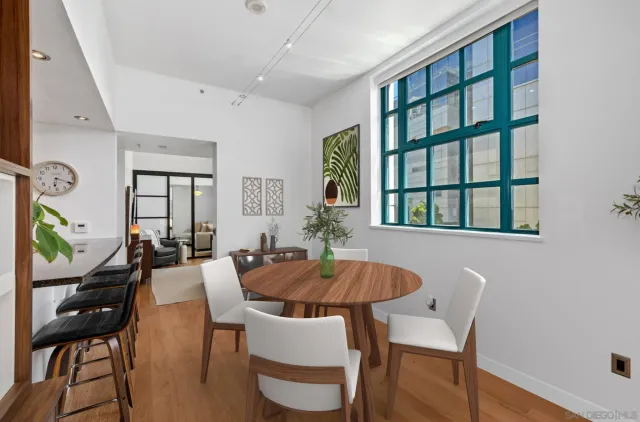 a view of a dining room with furniture and window