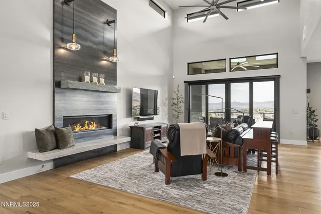 a large kitchen with kitchen island a island a stove a sink a dining table and chairs