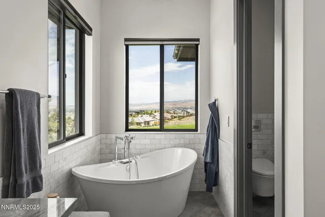 a view of entryway with furniture and wooden floor