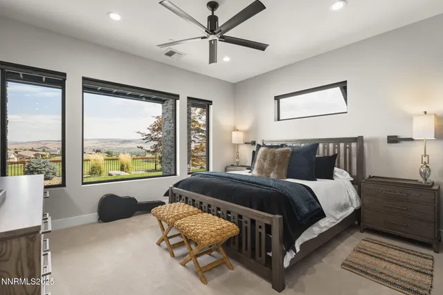 a view of a balcony with chairs and wooden floor