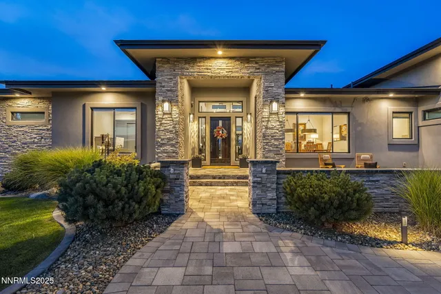 an aerial view of multiple houses with yard
