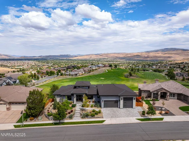 an aerial view of a house with a garden