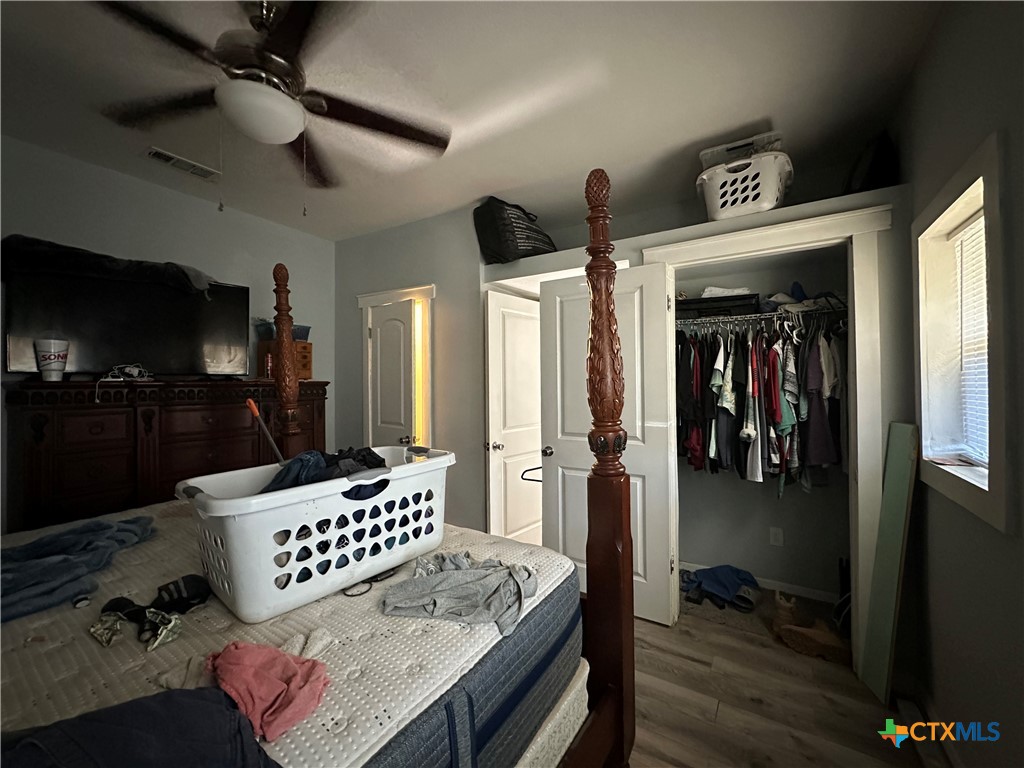 405 North Main Street Copperas Cove, TX 76522 - Photo 8 of 16 a bedroom with furniture and a flat screen tv