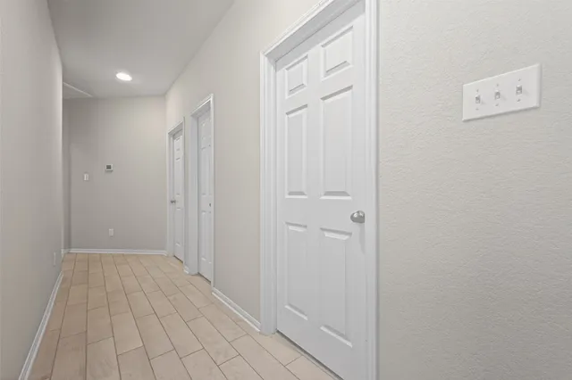 a view of a hallway with closet area