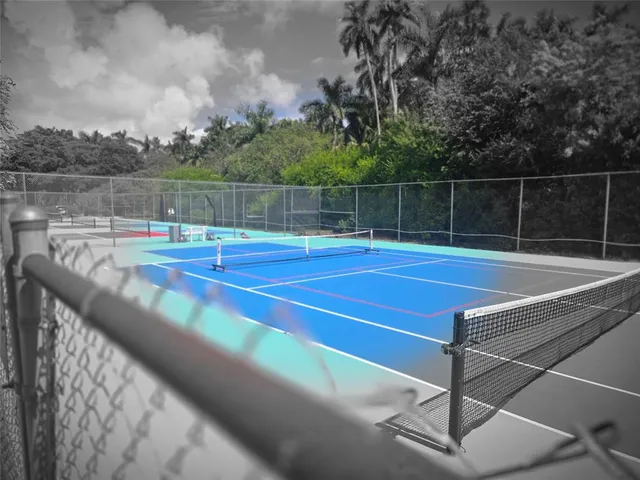 a view of a tennis court with basket ball court