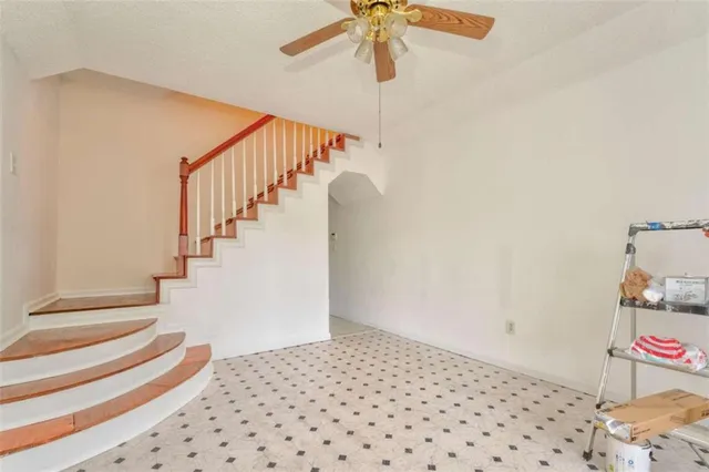 a white toilet sitting next to a bathroom sink