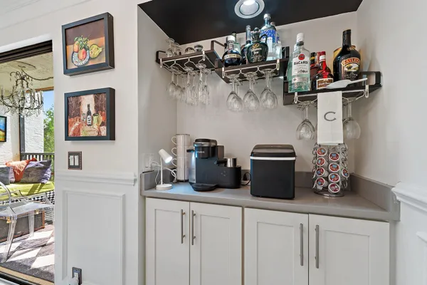 a kitchen with a refrigerator and cabinets