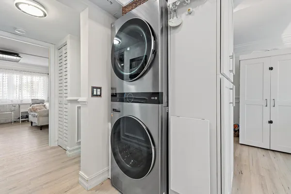 a view of a hallway with washer and dryer