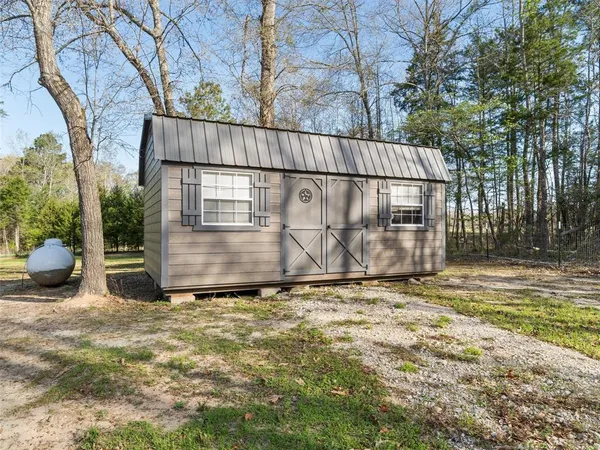 a view of outdoor space with deck and tree