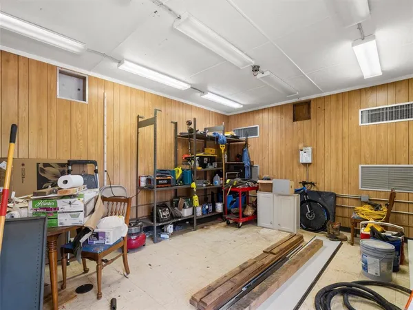 a view of a livingroom with workspace and a window