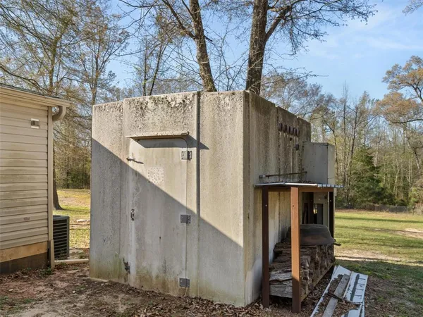a view of a house with a large tree