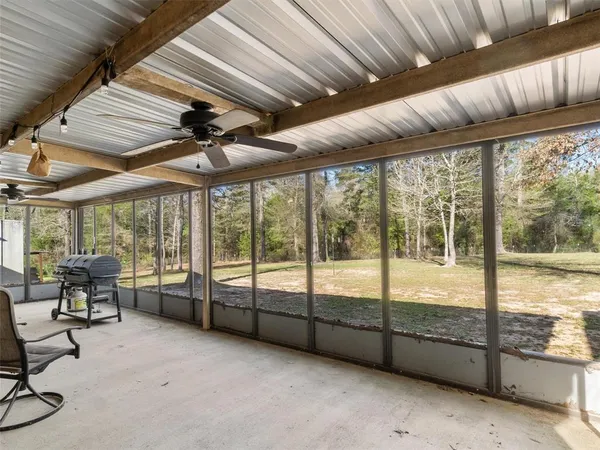 a view of a porch with furniture