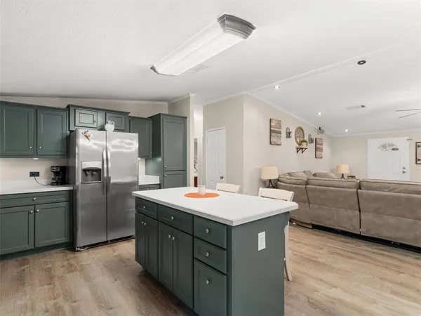 a kitchen with a sink stove and refrigerator