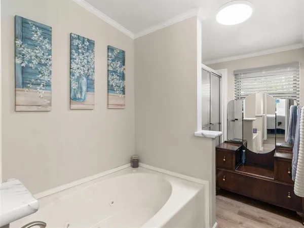 a bathroom with a bathtub and a shower