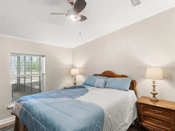 a bedroom with a bed and window