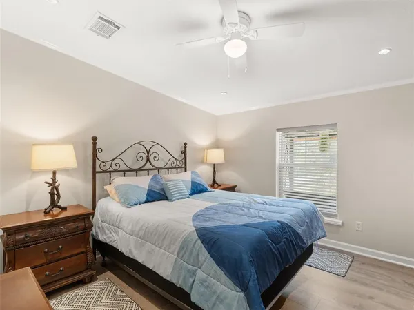 a bedroom with a bed and window