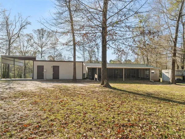a view of a house with a yard and garage