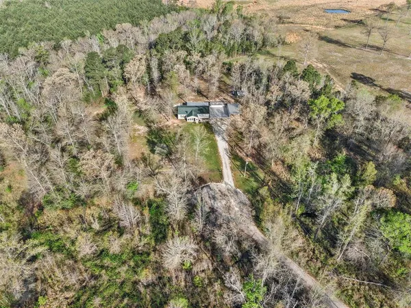 a aerial view of a house with a yard