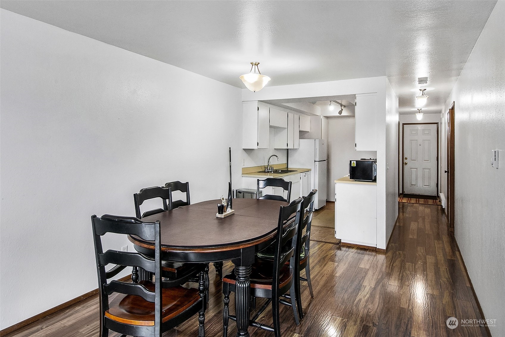 1015 Southwest 149th Street Burien, WA 98166 - Photo 11 of 31 a view of a dining room with furniture and wooden floor