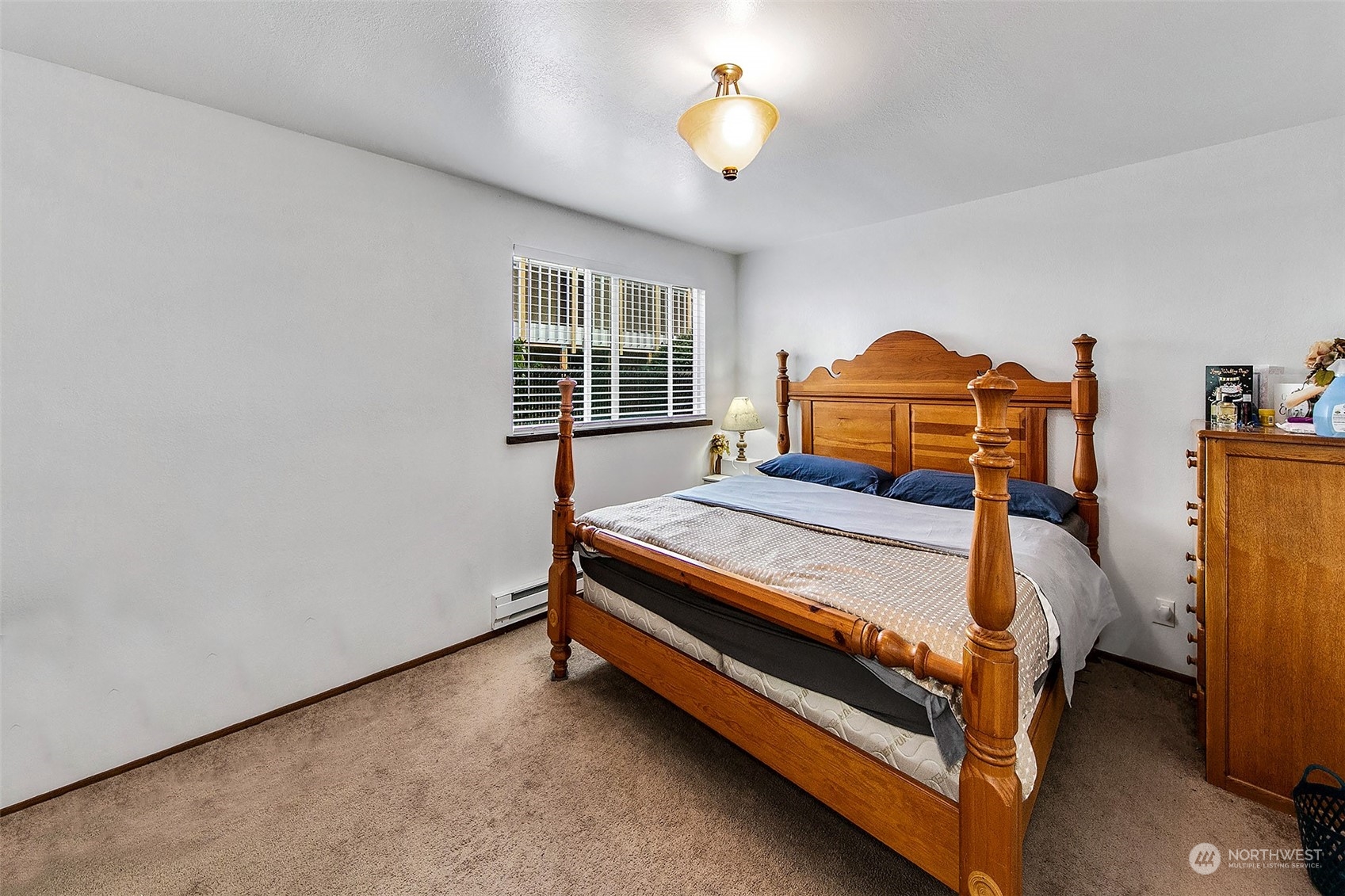 1015 Southwest 149th Street Burien, WA 98166 - Photo 7 of 31 a bed sitting in a room next to a window