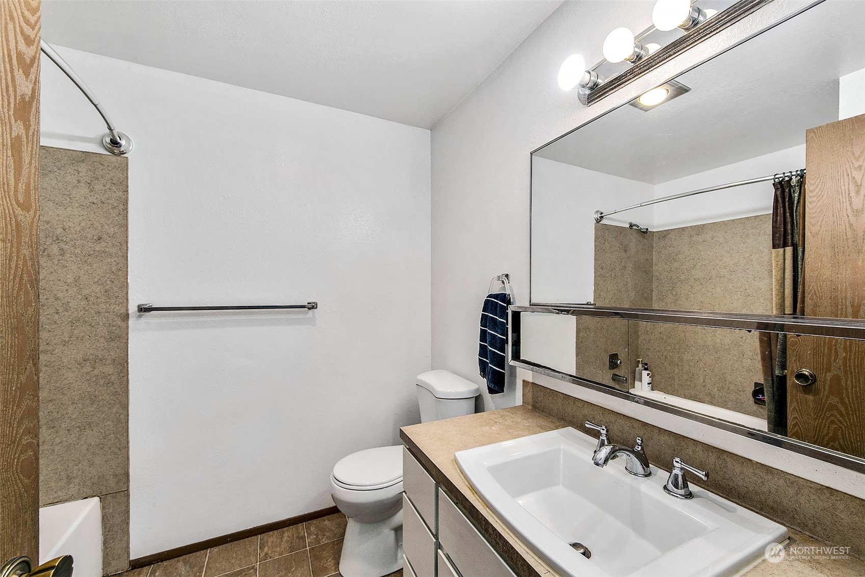 1015 Southwest 149th Street Burien, WA 98166 - Photo 8 of 31 a bathroom with a sink toilet and mirror