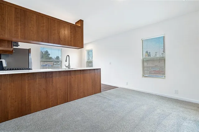 a view of kitchen with cabinets