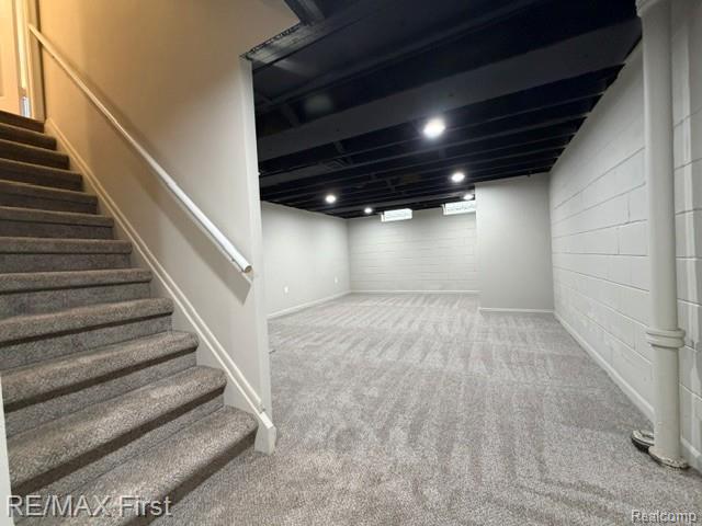 971 Canterbury Road Grosse Pointe, MI 48236 - Photo 28 of 30 Carpeted staircase with handrail, carpeted flooring, painted ceiling beams, recessed lighting, and painted block walls