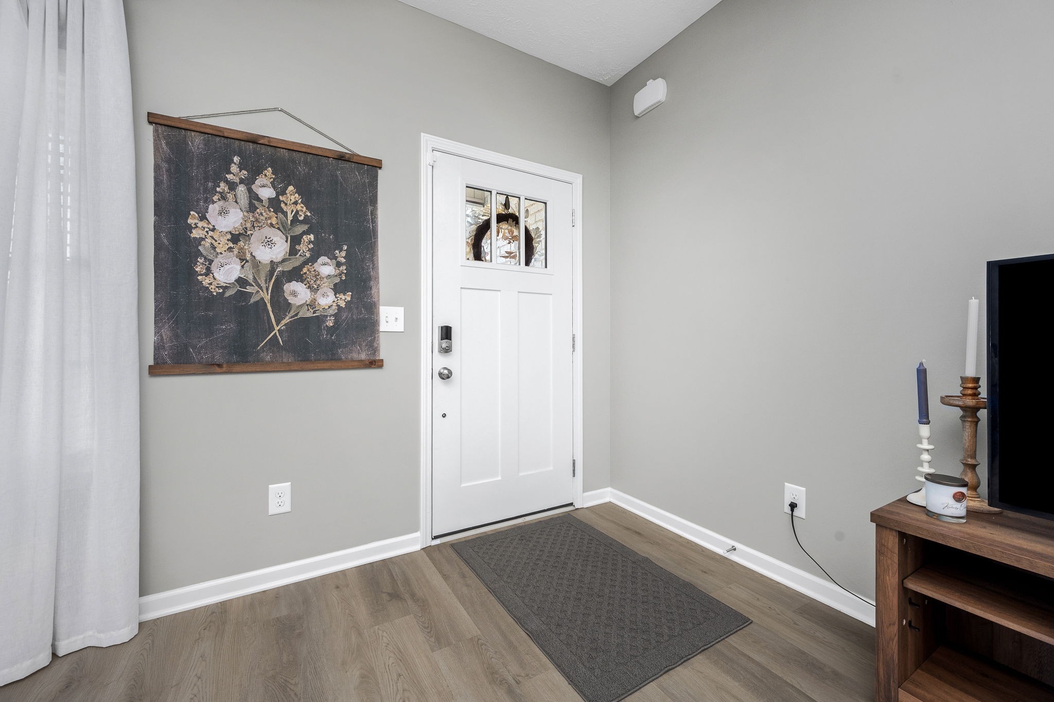 64 North Fork Branch Road Tullahoma, TN 37388 - Photo 11 of 49 a view of a livingroom with wooden floor and a flat screen tv