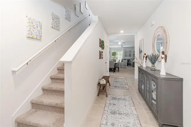 a view of entryway and hall with wooden floor