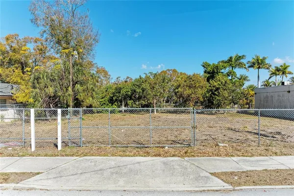 a view of a yard with a tree