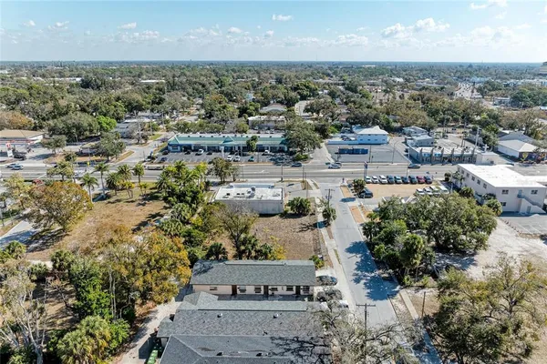 an aerial view of residential houses with outdoor space
