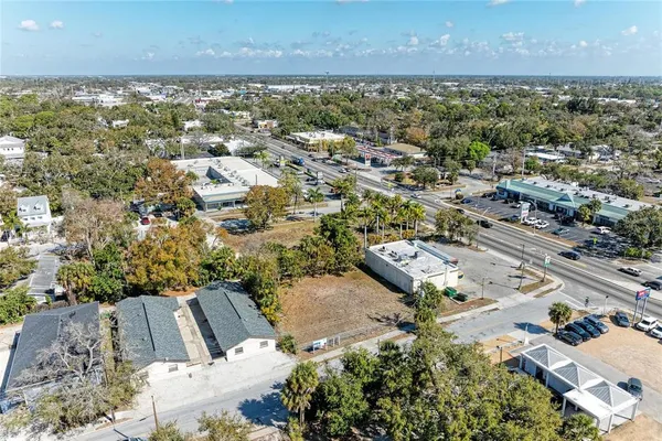 an aerial view of a house with a yard