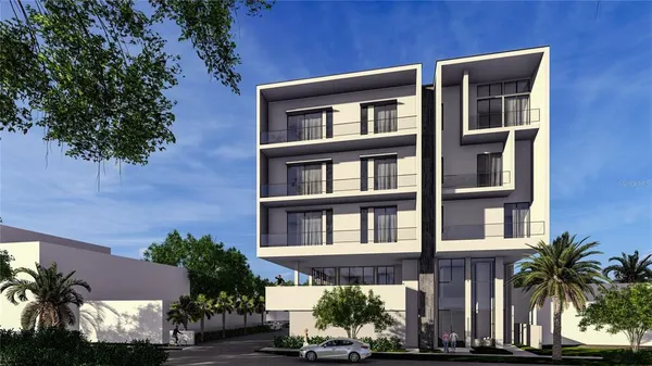 front view of a building with cars parked in front of it