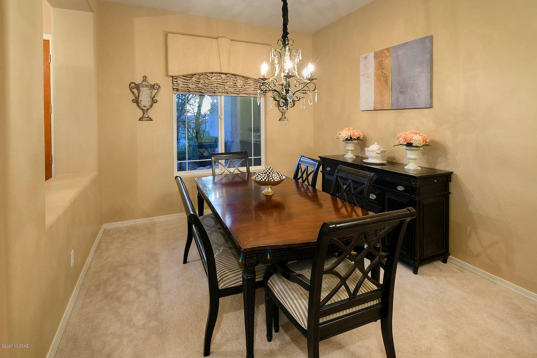 12740 North Morgan Ranch Road Oro Valley, AZ 85755 - Photo 14 of 32 a view of a dining room with furniture and chandelier
