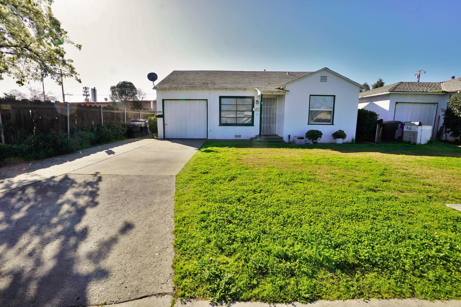 605 East Myrtle Street Hanford, CA 93230 - Photo 1 of 17 a front view of a house with yard