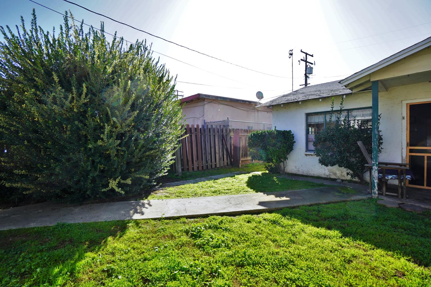 605 East Myrtle Street Hanford, CA 93230 - Photo 12 of 17 a view of a back yard of the house