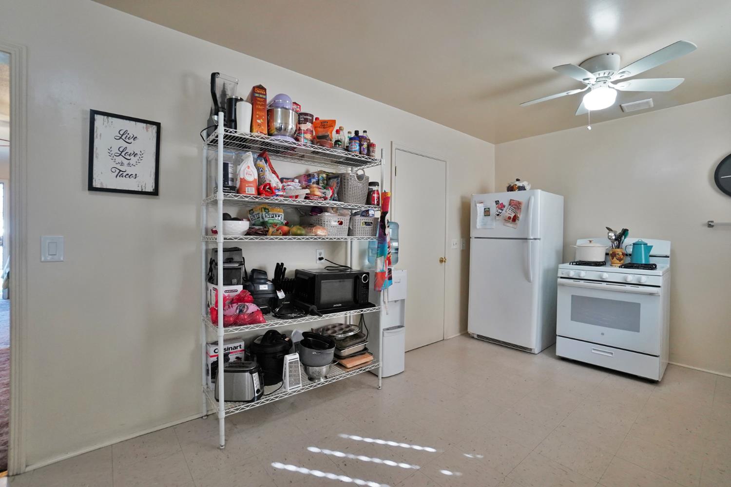 605 East Myrtle Street Hanford, CA 93230 - Photo 6 of 17 a view of walk in closet with clothes and shoes