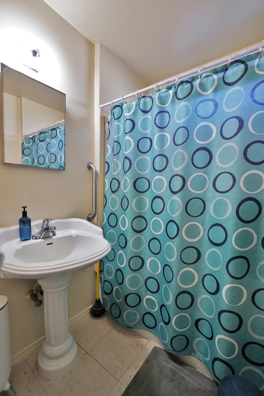 605 East Myrtle Street Hanford, CA 93230 - Photo 8 of 17 a bathroom with a sink and a mirror