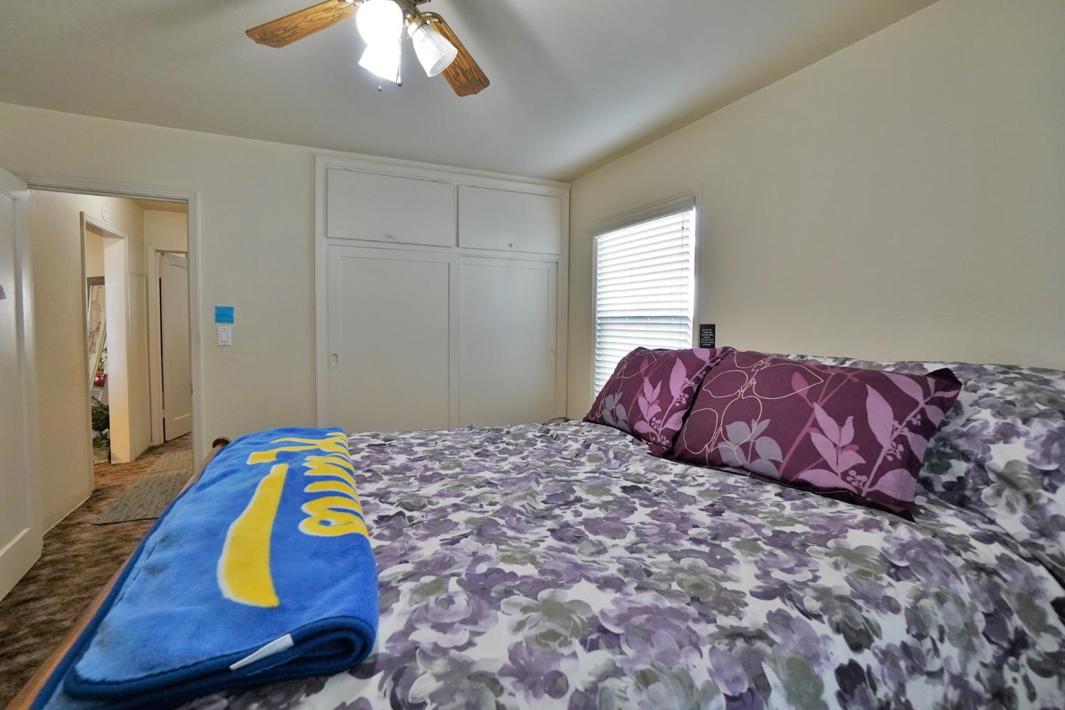 605 East Myrtle Street Hanford, CA 93230 - Photo 10 of 17 a bedroom with bed and balcony